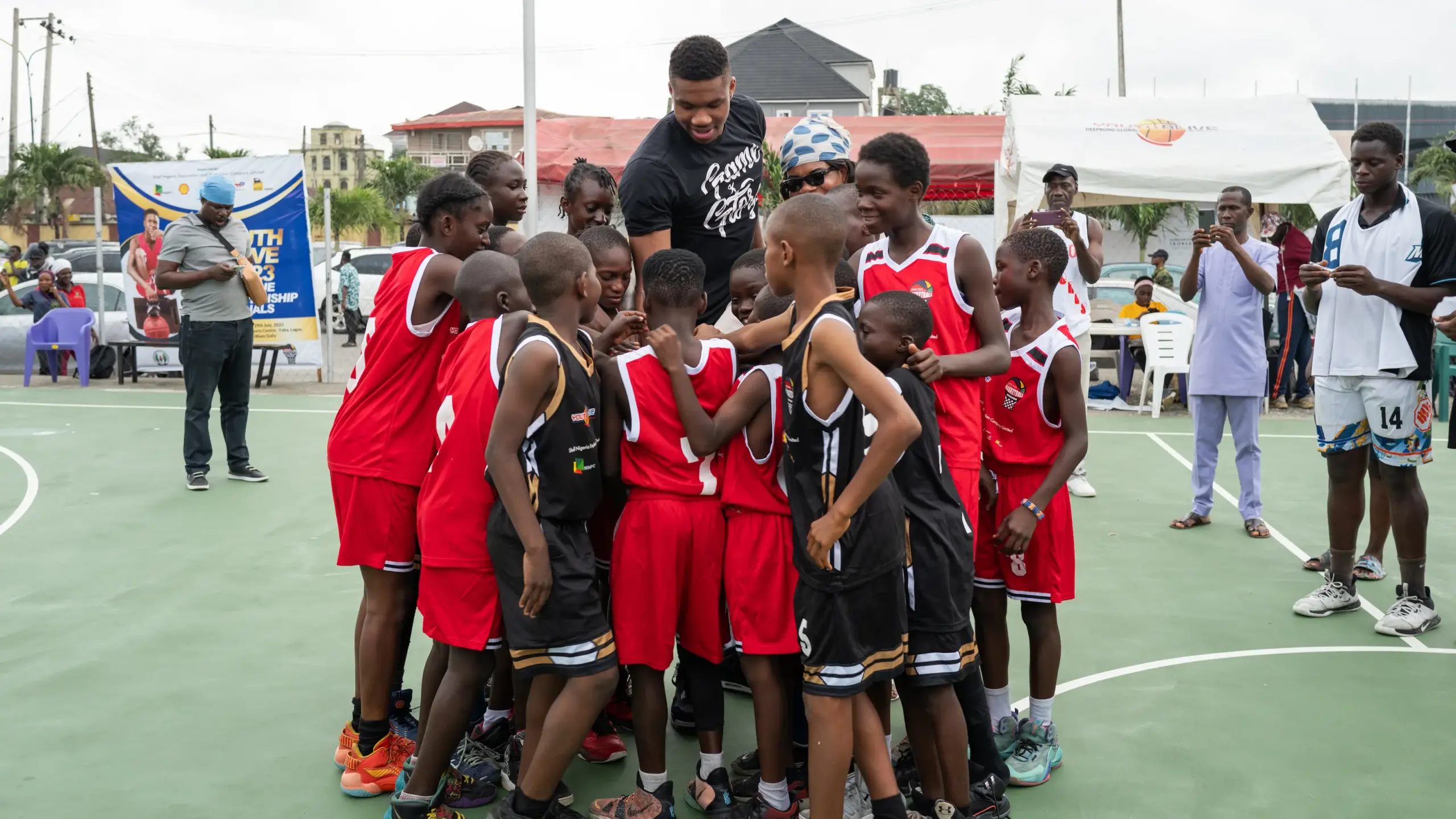 Watch Video Of NBA Star, Giannis Antetokounmpo Buying His Own 'Fake Jersey' At Lagos Market