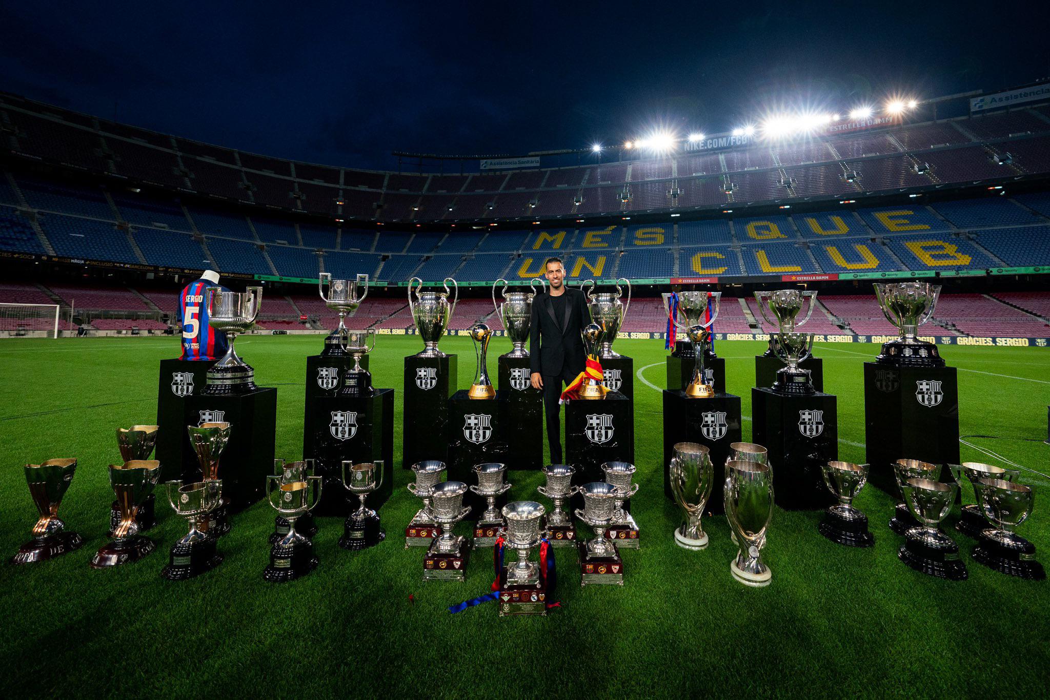 Sergio Busquets posing with all-time trophies