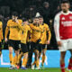 Wolverhampton Wanderers Players Celebrating An Equalizing Goal Against Arsenal