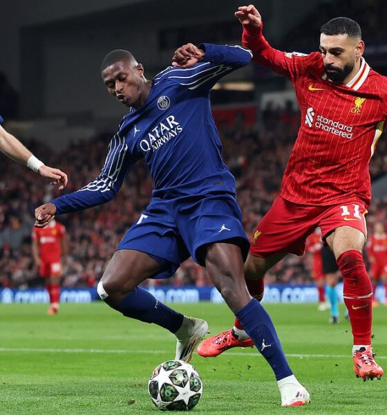 Ousmane Dembélé and Khvicha Kvaratskhelia of PSG battle Mohamed Salah of Liverpool in a Champions League clash at Anfield