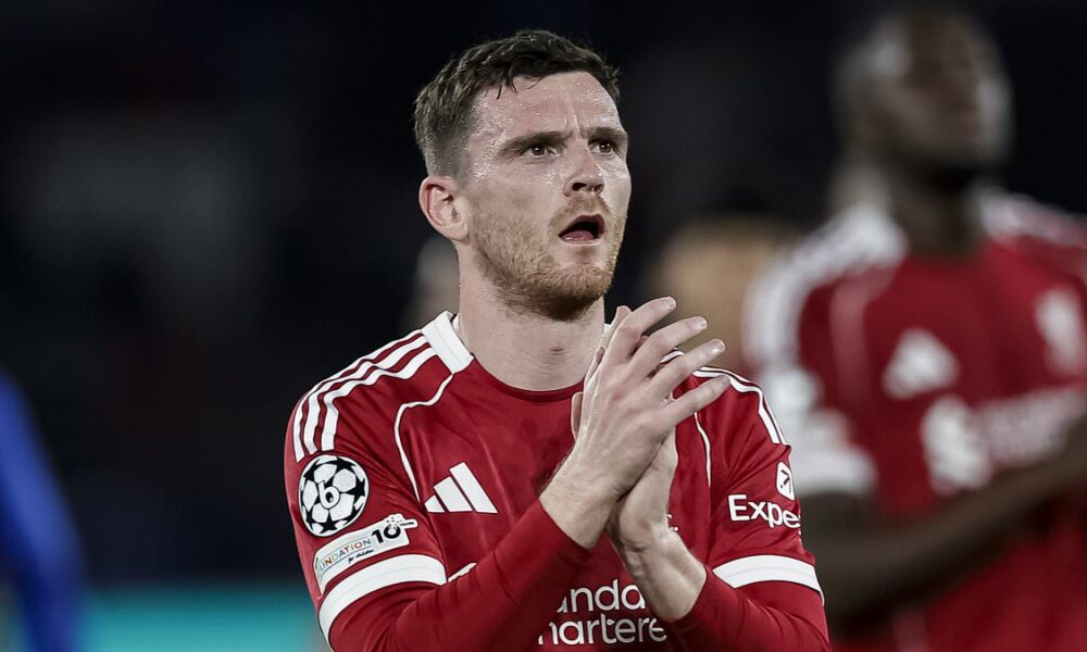 Liverpool defender Andrew Robertson clapping for fans in the 2025/26 home kit during a Champions League match.A photo used by Sportxparte news