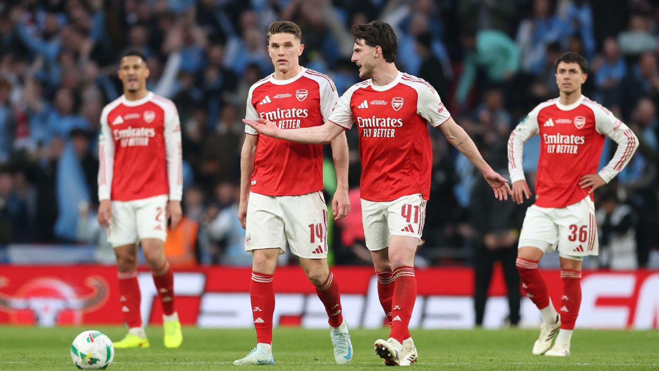 Arsenal stars Declan Rice (41) and new striker Viktor Gyökeres in conversation on the pitch. They are flanked by teammates William Saliba (2), Jurriën Timber (12), and Martín Zubimendi (36) in their 2025/26 red and white home kits.. Image used for Sportxparte news.