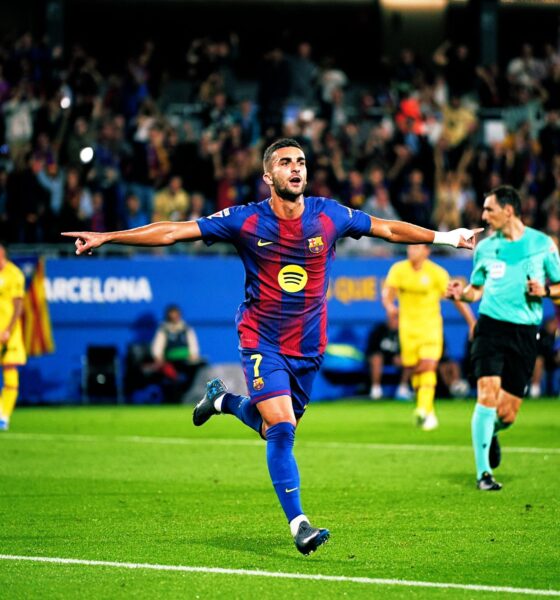 Ferran Torres, celebrates a goal during a match against Getafe. He is running across the green pitch with his arms outstretched and a joyful expression. Image used for Sportxparte news.
