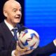 FIFA president Gianni Infantino is holding the World Cup 2026 ball in a press conference. Image used for Sportxparte news.