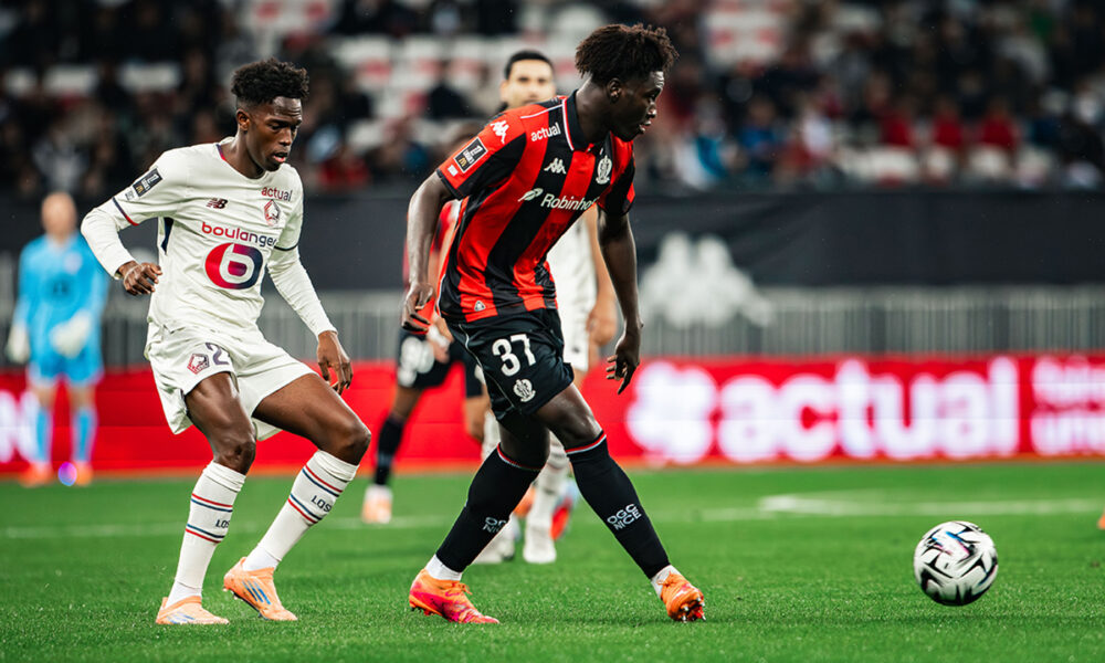 Portuguese defender Tiago Santos of Lille OSC (left, in white) and midfielder Reda Belahyane of OGC Nice (right, in red and black) competing for the ball during a Ligue 1 fixture. Image used for Sportxparte news.