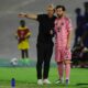 Lionel Messi and coach Javier Mascherano on the pitch in the Inter Miami 24/25 Home Authentic Jersey. Messi wears the pink "Euforia" kit with his iconic number 10, standing next to Mascherano in all-black sideline gear during an Inter Miami CF match. Image used for Sportxparte news.