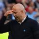Liverpool Manager Arne Slot is holding his head after a defeat.
