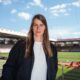 Marie-Louise Eta, the first female head coach in Bundesliga history, is standing at the FC Union Berlin stadium. Image used for Sportxparte news.