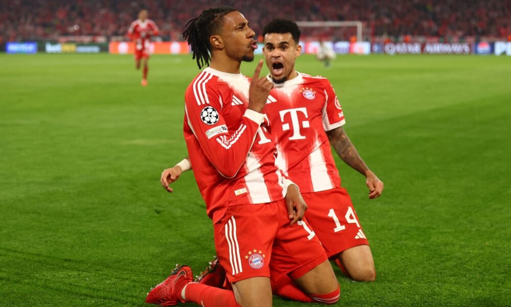This image captures Michael Olise and Luis Díaz celebrating a late goal during the UEFA Champions League quarter-final second leg between Bayern Munich and Real Madrid on April 15, 2026. Image used for Sportxparte news.