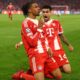 This image captures Michael Olise and Luis Díaz celebrating a late goal during the UEFA Champions League quarter-final second leg between Bayern Munich and Real Madrid on April 15, 2026. Image used for Sportxparte news.