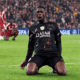 Ousmane Dembélé celebrating a goal for Paris Saint-Germain during a UEFA Champions League quarter-final match against Liverpool at Anfield on April 14, 2026. Image used for Sportxparte news