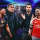 A promotional graphic for the 2026 UEFA Champions League Final featuring key figures from Paris Saint-Germain and Arsenal FC. The left side, representing PSG, shows players Vitinha and Ousmane Dembélé alongside manager Luis Enrique in dark blue kits. The right side, representing Arsenal, features manager Mikel Arteta and players Bukayo Saka and Gabriel Magalhães in classic red and white kits. Image used for Sportxparte news.