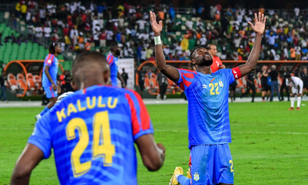 The person on his knees with his arms raised is professional footballer Chancel Mbemba, the captain of the DR Congo national football team. Image used for Sportxparte news.