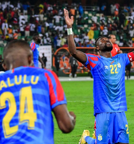 The person on his knees with his arms raised is professional footballer Chancel Mbemba, the captain of the DR Congo national football team. Image used for Sportxparte news.