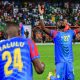 The person on his knees with his arms raised is professional footballer Chancel Mbemba, the captain of the DR Congo national football team. Image used for Sportxparte news.