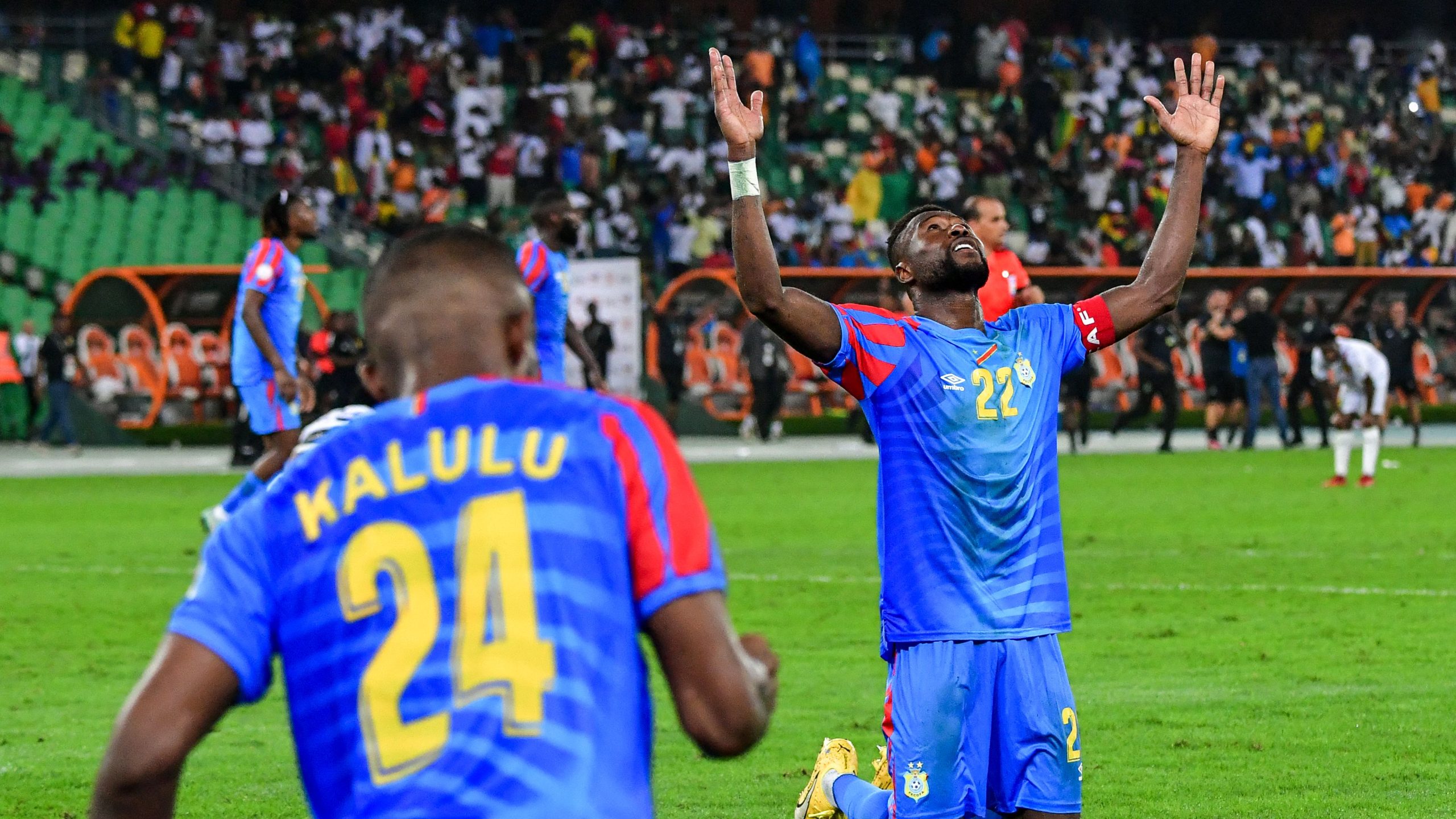 The person on his knees with his arms raised is professional footballer Chancel Mbemba, the captain of the DR Congo national football team. Image used for Sportxparte news.