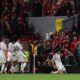 Harry Maguire of Manchester United celebrates a late winning goal during a Premier League match against Liverpool at Anfield. Image used for Sportxparte preview news.