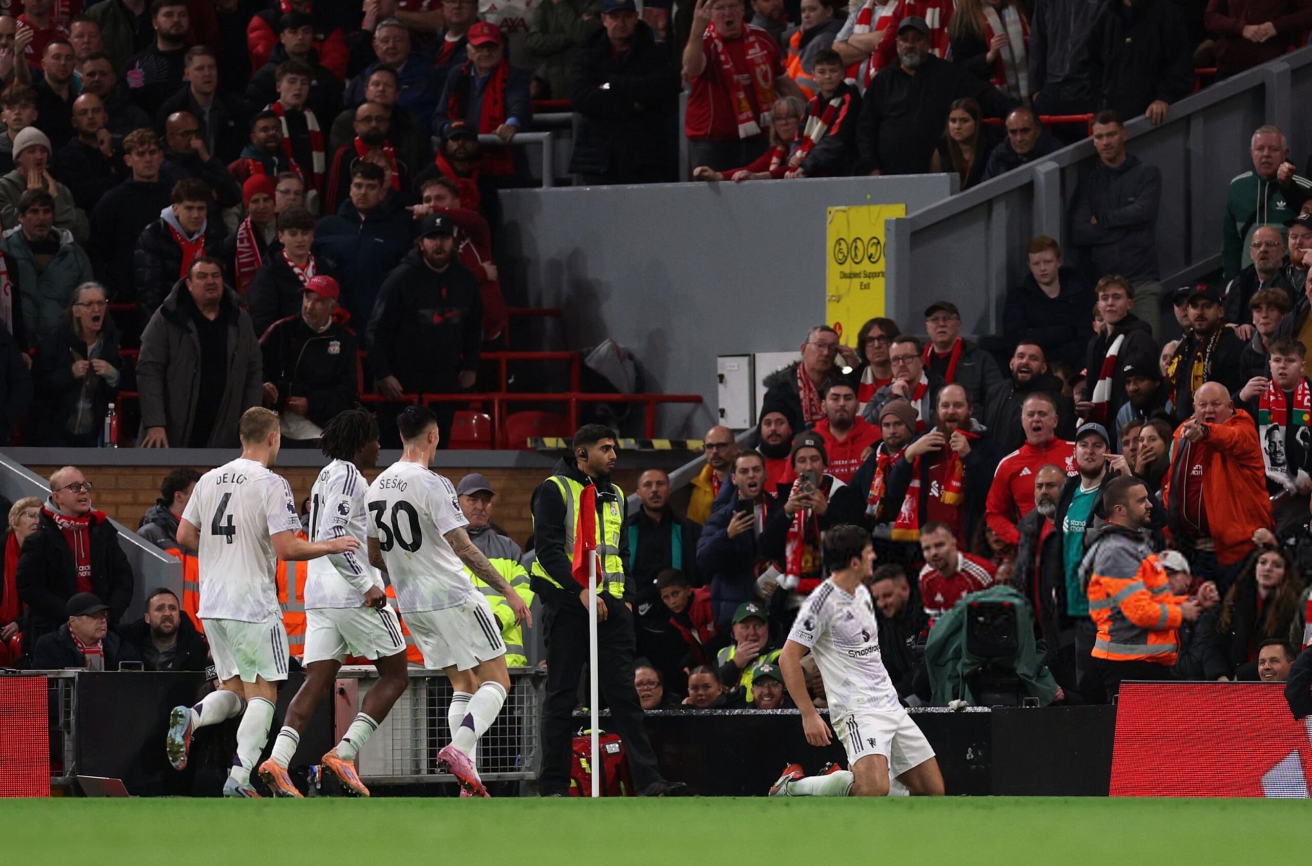 Harry Maguire of Manchester United celebrates a late winning goal during a Premier League match against Liverpool at Anfield. Image used for Sportxparte preview news.