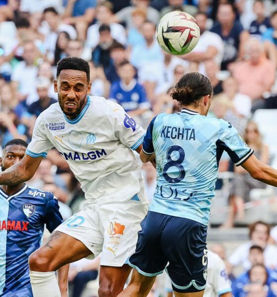 Ligue 1 match between Olympique de Marseille and Le Havre AC, where Marseille's forward Pierre-Emerick Aubameyang and Le Havre's midfielder Yassine Kechta are competing for a header. Image used for Sportxparte news.
