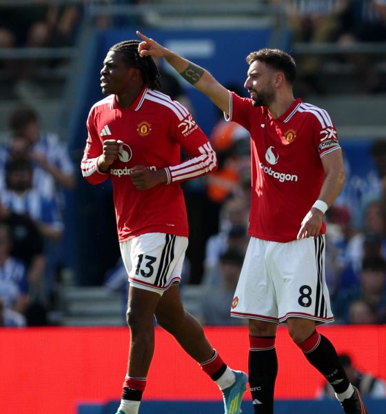 Manchester United players Patrick Dorgu (number 13) and Bruno Fernandes (number 8) celebrate a goal during their final-day Premier League match. Image used for Sportxparte news.