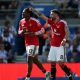 Manchester United players Patrick Dorgu (number 13) and Bruno Fernandes (number 8) celebrate a goal during their final-day Premier League match. Image used for Sportxparte news.
