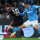 Nico Paz of Como 1907 (wearing black) and Giovane Santana do Nascimento of SSC Napoli (wearing light blue) competing for the ball during a Coppa Italia quarter-final match. Image used for Sportxparte preview news.