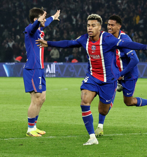 Paris Saint-Germain (PSG) players, including Désiré Doué (centered, arms outstretched) and Ousmane Dembélé (left, in foreground), celebrate a decisive goal during a Ligue 1 match against Stade Brestois 29 on May 10, 2026. Image used for Sportxparte news roundup.