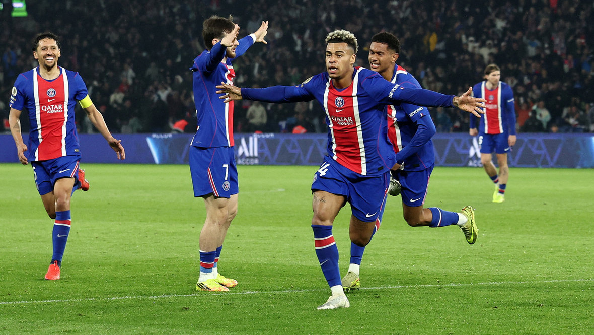 Paris Saint-Germain (PSG) players, including Désiré Doué (centered, arms outstretched) and Ousmane Dembélé (left, in foreground), celebrate a decisive goal during a Ligue 1 match against Stade Brestois 29 on May 10, 2026. Image used for Sportxparte news roundup.