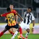 Serie A football match showing Khéphren Thuram of Juventus in a black-and-white striped jersey dribbling the ball. He is being closely defended from behind by Lameck Banda of US Lecce, who is wearing a yellow and red striped kit with the number 29. Image used for Sportxparte news.