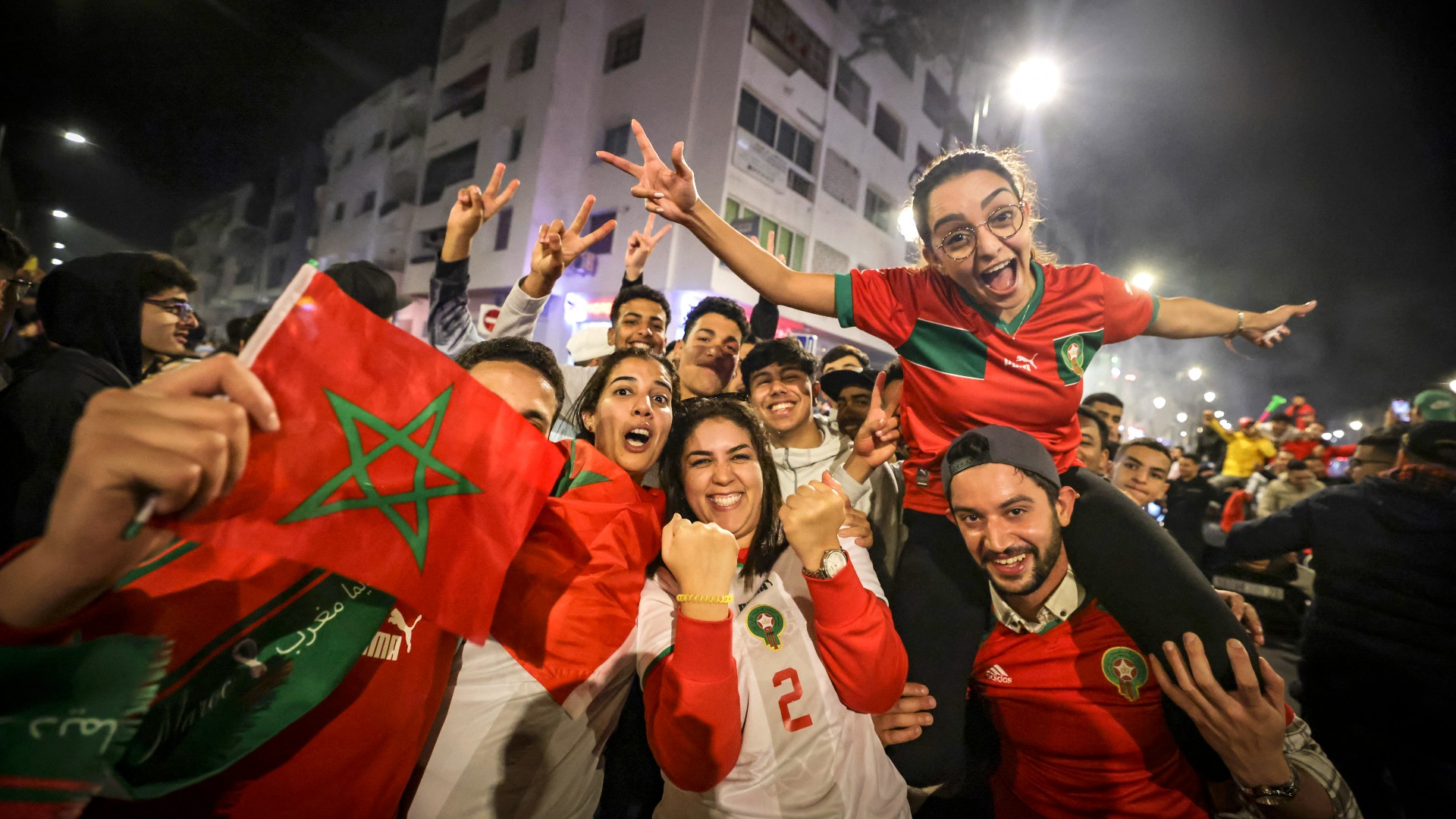 Moroccan football supporters are seen celebrating in Rabat, Morocco. The historic gathering took place in December 2022 following the national team's monumental victory over Portugal, making them the first African and Arab nation to ever reach a FIFA World Cup semifinal. Image used for Sportxparte news.