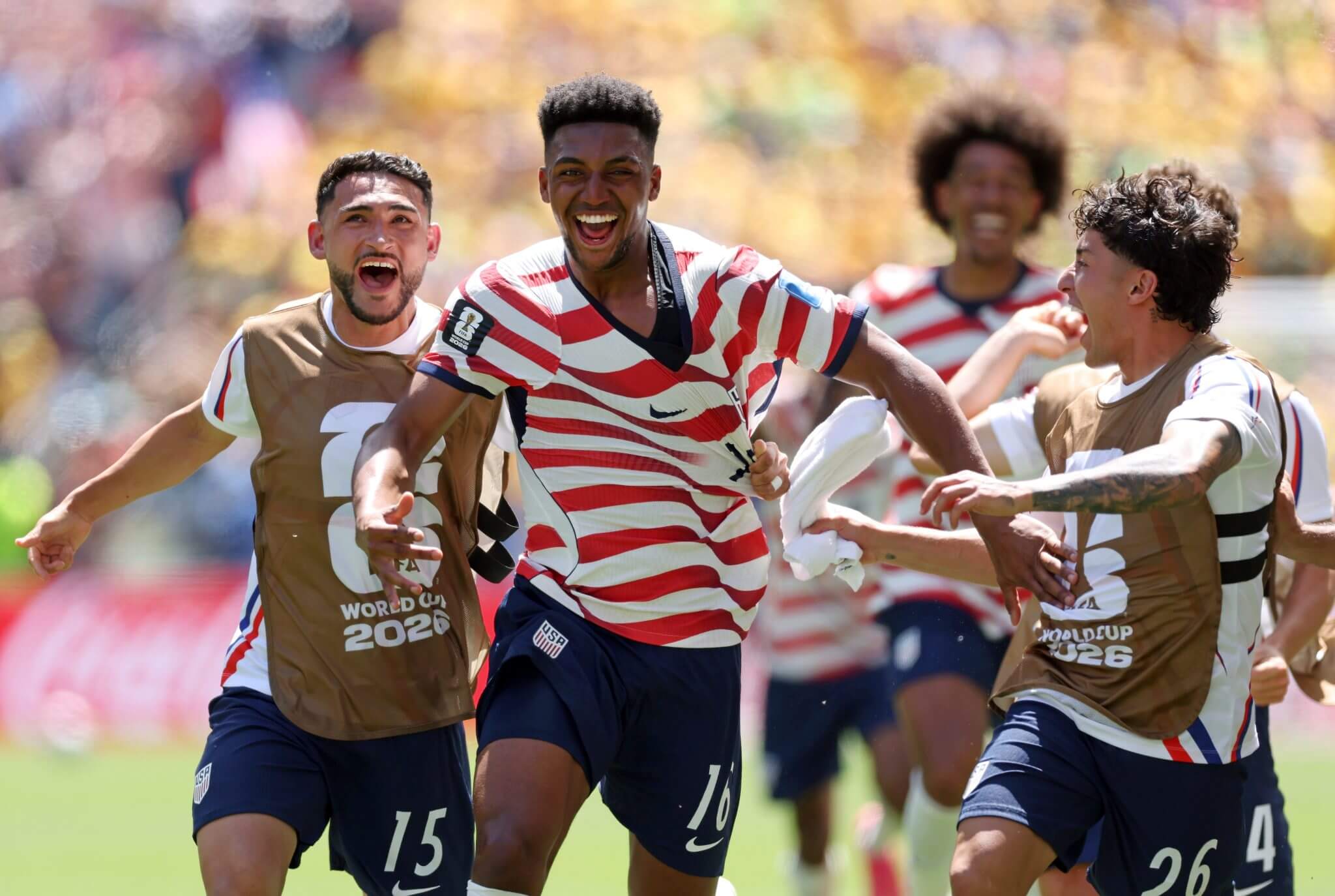 USA soccer players Alex Freeman (center), Cristian Roldan (left), and Alex Zendejas (right) celebrating a goal during their 2-0 Group D victory against Australia at the 2026 World Cup in Seattle. Image used for Sportxparte news.