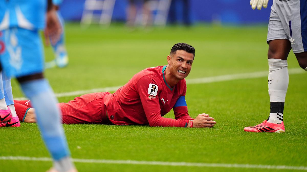 Cristiano Ronaldo is pictured lying on the pitch during Portugal's 1-1 draw against DR Congo. The photograph captures the forward expressing frustration during their opening Group K match of the 2026 FIFA World Cup. Image used for Sportxparte news.
