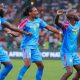 The Democratic Republic of the Congo (DR Congo) national football team is celebrating during their match at the 2023 Africa Cup of Nations (AFCON). Specifically, the players are celebrating a goal during their 3-1 quarter-final victory against Guinea on February 2, 2024. Image used for Sportxparte news.