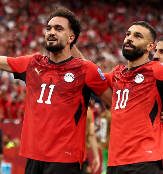Egypt national football team players Mostafa Mohamed (11) and Mohamed Salah (10) celebrate a goal during a 2026 FIFA World Cup match against New Zealand. Image used for Sportxparte news.