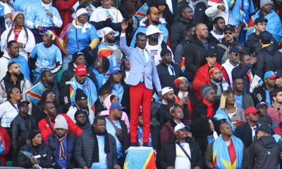 Michel Nkuka Mboladinga or "Lumumba Vea," became famous for standing motionless during DR Congo matches to honor the country's first leader, Patrice Lumumba. Image used for Sportxparte news.