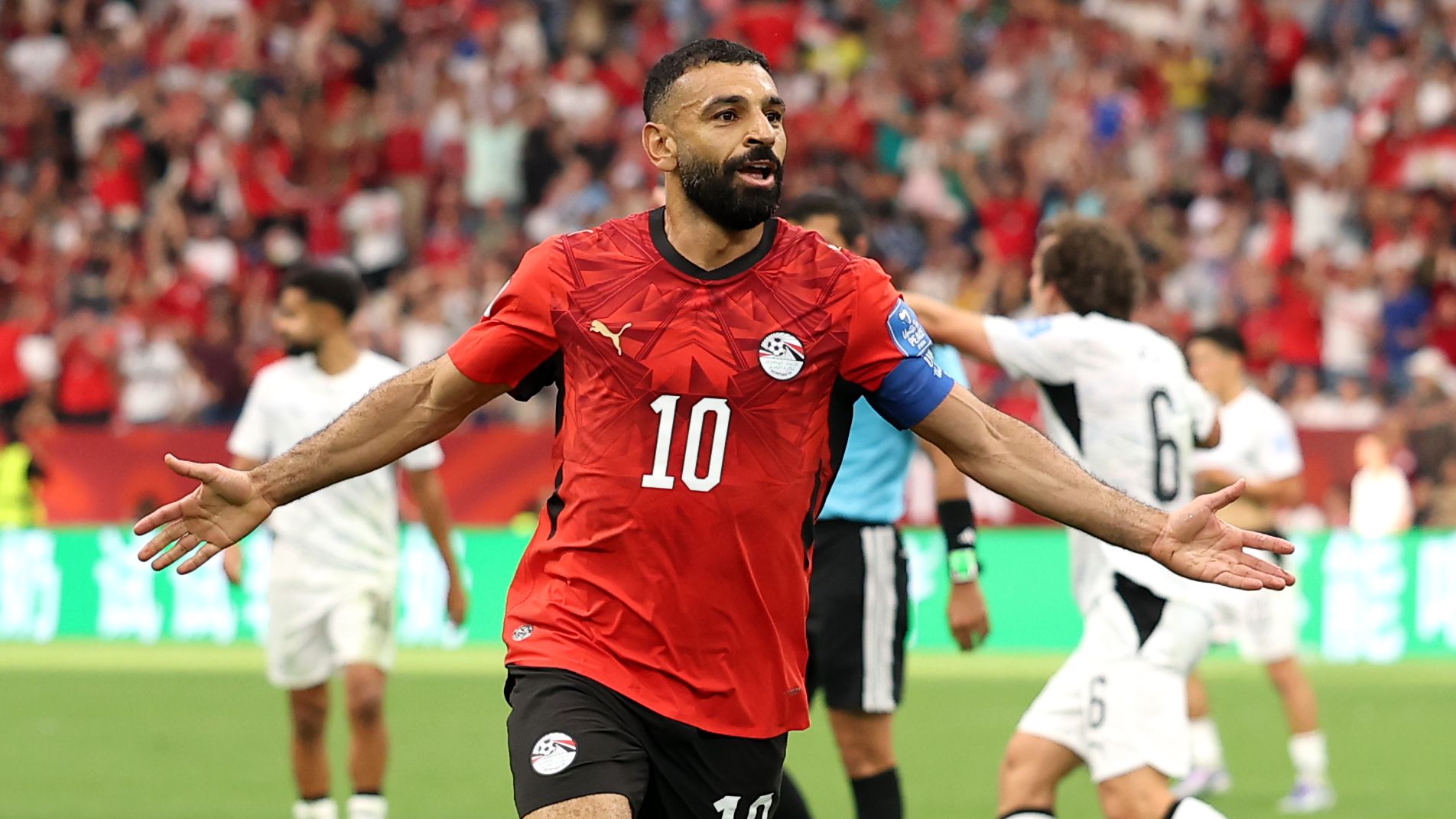 Egyptian forward Mohamed Salah celebrates a goal during Egypt's historic 3-1 World Cup win against New Zealand. Image used for Sportxparte news.