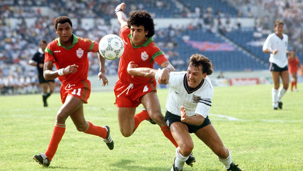 England captain Bryan Robson battling for possession against Moroccan defender Mustapha El Biyaz (center) and forward Mustapha Merry (left) during the 1986 FIFA World Cup. Image used for Sportxparte news