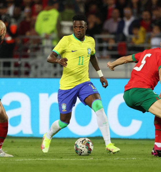Vinícius Júnior, wearing the number 11 yellow jersey for Brazil, is captured here during an international friendly against Morocco. The match took place on March 25, 2023, at the Ibn Batouta Stadium in Tangier, Morocco. Image used for Sportxparte news.