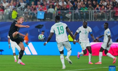 Norway’s Erling Haaland shoots and scores a goal past Senegal defenders Moussa Niakhaté and Kalidou Koulibaly during a 2026 World Cup Group I match. Image used for Sportxparte news.