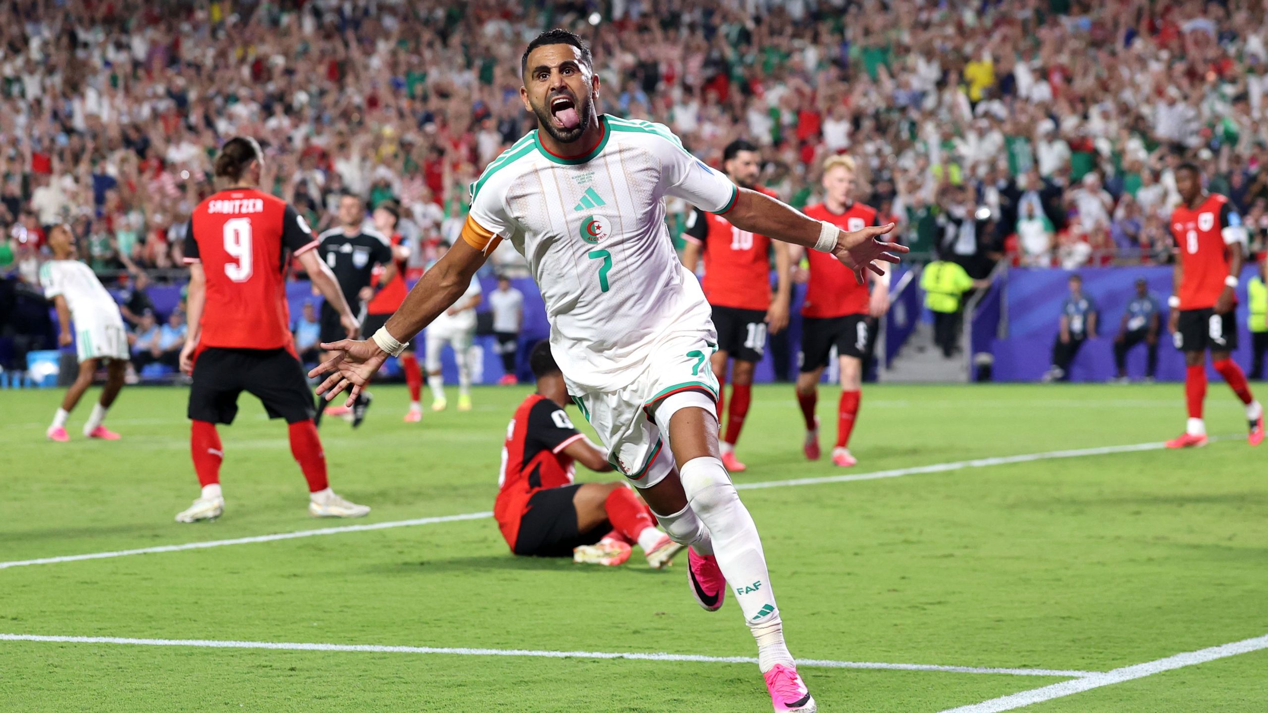 Algerian football captain Riyad Mahrez celebrates a goal during a 3-3 draw against Austria at the 2026 FIFA World Cup. Image used for Sportxparte news.