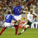 Senegal's El Hadji Diouf driving the ball past France's Patrick Vieira (No. 4) and Marcel Desailly (No. 8) during the opening match of the 2002 FIFA World Cup. Image used for Sportxparte news.