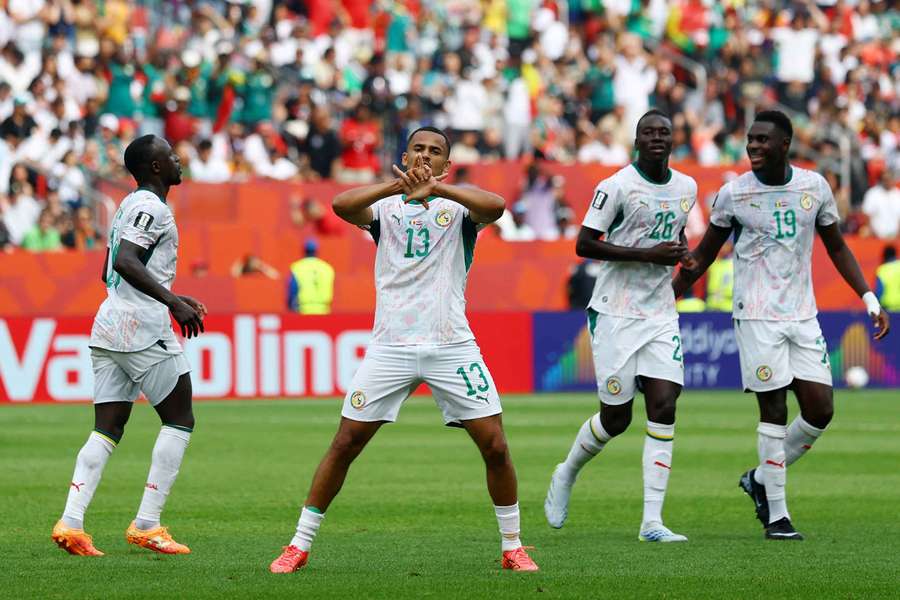 Senegal's Iliman Ndiaye celebrates scoring with teammates during a 5-0 victory over Iraq at the 2026 FIFA World Cup. Image used for Sportxparte news.
