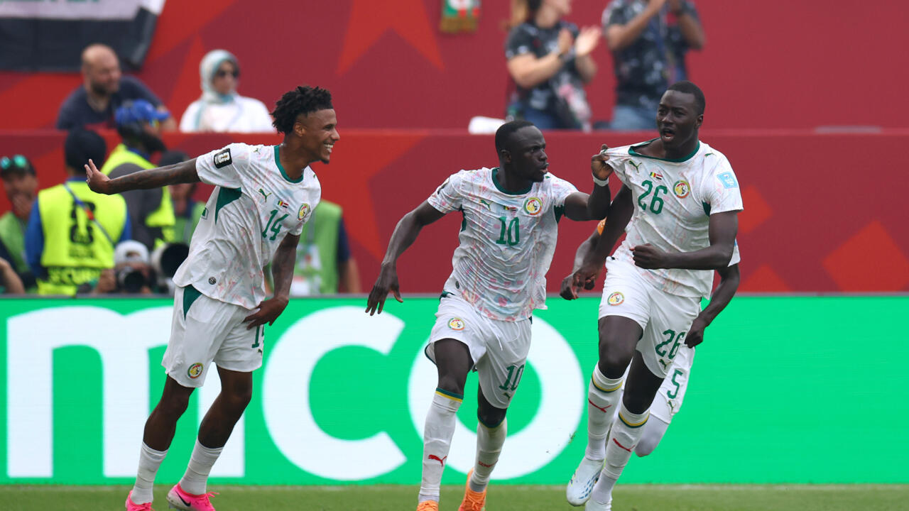Senegal national football team players Pape Gueye (#26), Sadio Mané (#10), and Ismail Jakobs (#14) celebrate during their 5-0 victory against Iraq at the 2026 FIFA World Cup. Image used for Sportxparte news.