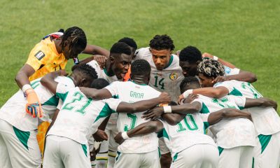 Senegal national football team in a huddle during their historic 5-0 victory against Iraq at the 2026 FIFA World Cup. Image used for Sportxparte news.
