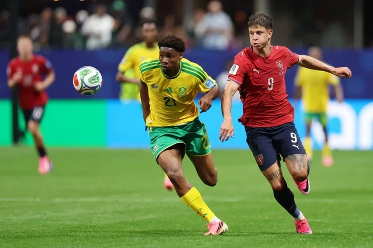 South Africa's Ime Okon and Czechia's Adam Hložek compete for the ball during a 2026 FIFA World Cup Group A match in Atlanta. Image used for Sportxparte news.