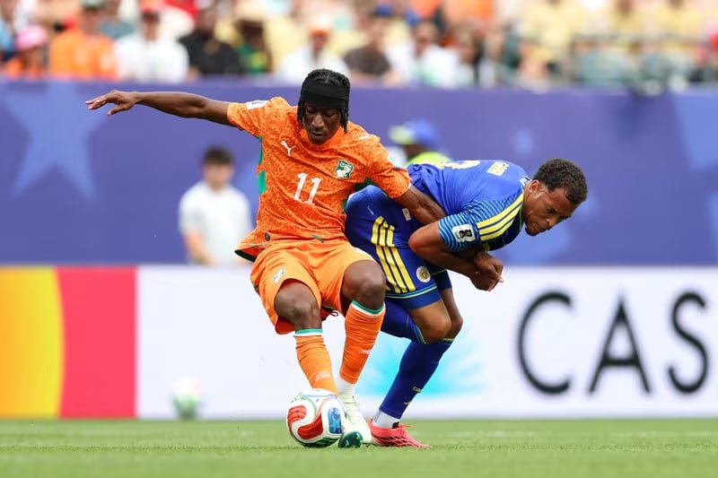 Yan Diomandé of the Ivory Coast shields the ball from a Curaçao defender during the 2026 FIFA World Cup Group E match at Lincoln Financial Field. Image used for Sportxparte news.