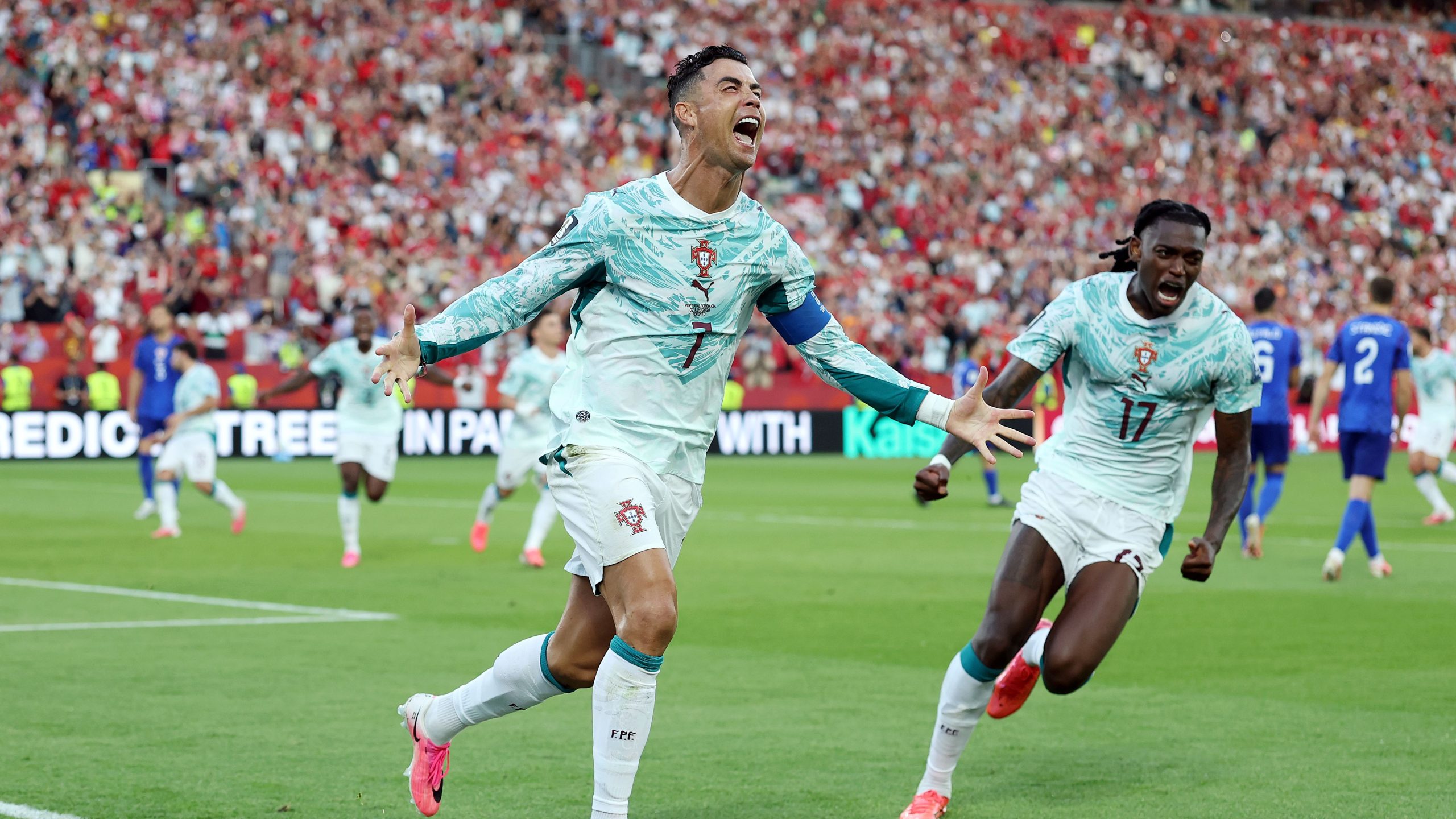 Cristiano Ronaldo is celebrating his penalty goal during Portugal's dramatic 2-1 victory over Croatia in the 2026 FIFA World Cup Round of 32. Image used for Sportxparte news.