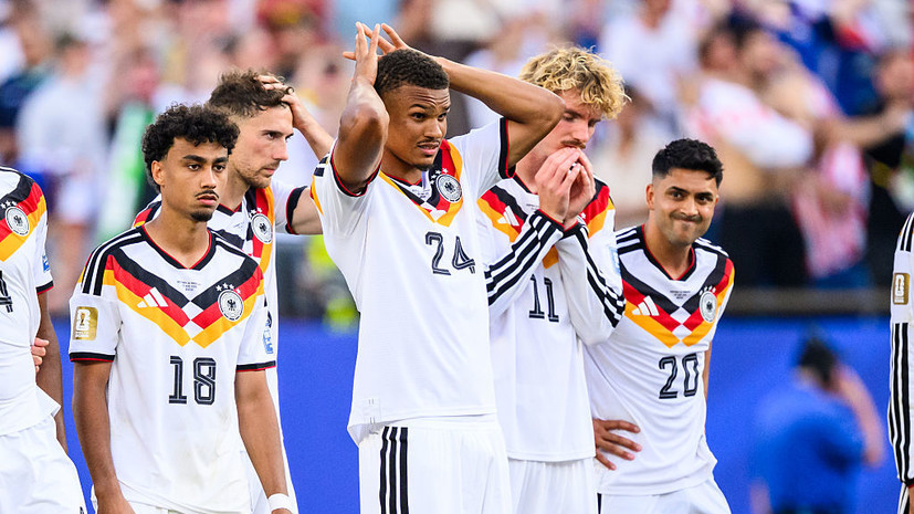 Germany national football team players looking devastated after being eliminated by Paraguay in a penalty shootout during the 2026 FIFA World Cup Round of 32 match near Boston. Image used for Sportxparte news.