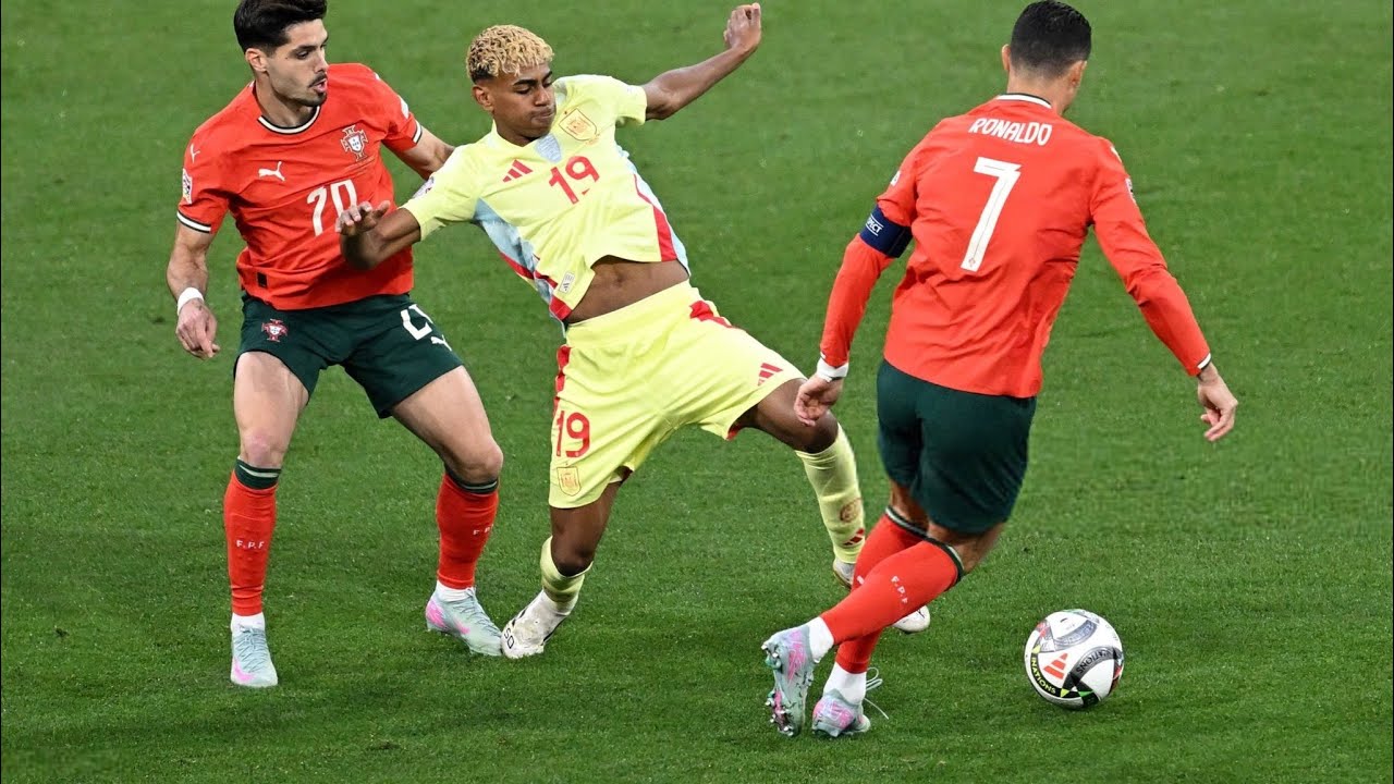 Spanish forward Lamine Yamal (number 19) is battling for possession against Portuguese players Pedro Neto (number 20) and Cristiano Ronaldo (number 7). Image used for Sportxparte news.