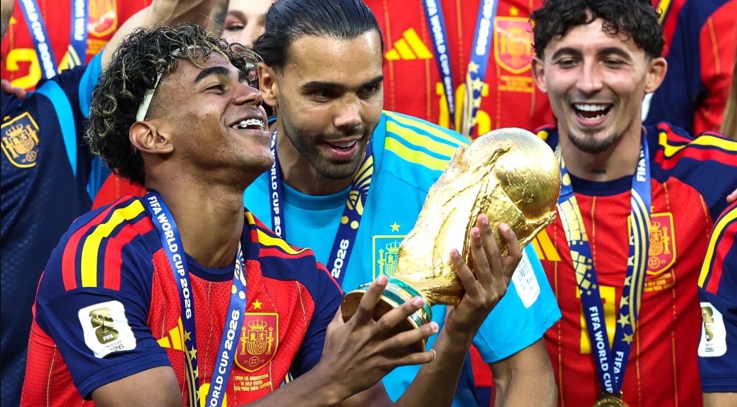 Spanish forward Lamine Yamal celebrates alongside teammates like goalkeeper David Raya after defeating Argentina 1-0 in extra time during the tournament final at MetLife Stadium on July 19, 2026. Image used for Sportxparte news.